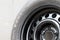 Used winter studded tire for car.Studded wheel for car close-up