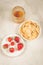 Useful breakfast with strawberry, flakes and honey/useful breakfast with strawberry, flakes and honey on a white marble background