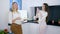 Useful food, pleased girls are photographed on telephone standing in kitchen with vegetarian meal