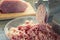 Useful home food. The process of grinding meat. Photo of cooking stuffing.