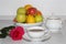 Useful morning breakfast for your sweetheart. Rose, tea and fresh fruits