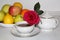 Useful morning breakfast for your sweetheart. Rose, tea and fresh fruits