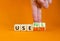 Useful or useless symbol. Concept words Useful or Useless on wooden cubes. Businessman hand. Beautiful orange table orange