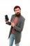 User outraged. Man brutal bully appearance hold smartphone isolated white. Bearded brutal guy pointing at smartphone