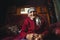 Ushguli, Georgia - June 12, 2014: Elderly Georgian woman sitting at her house in the Caucasus Mountains village