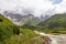 Ushguli- Patara Enguri River flowing down the valley in the Greater Caucasus Mountain Range in Georgia. Flowers