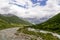 Ushguli- Patara Enguri River flowing down the valley in the Greater Caucasus Mountain Range in Georgia. Flowers