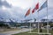 Ushuaia waterfront, with Argentina flag and snowy mountains