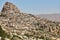 Usichar mountain castle caved in rock. Cappadocia landmark in Turkey