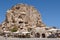 Usichar mountain castle caved in rock. Cappadocia landmark in Turkey