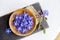 Using beautiful dark blue edible flower for food decoration Borago officinalis Borago or borage.