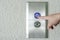 Using hands, press the elevator up and keypad elevator