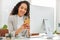 Using her connections to carve a way forward. a young businesswoman using a cellphone while working in an office.