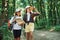 Using the map. Two girls is in the forest having a leisure activity, discovering new places