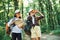 Using the map. Two girls is in the forest having a leisure activity, discovering new places