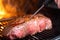 using a meat thermometer to ensure steak is cooked