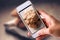 Using mobile phone to take photos of Chocolate Cookies on wooden background