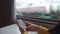Using a smartphone on the background of the window of a walking train