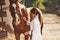 Using stethoscope. Female vet examining horse outdoors at the farm at daytime