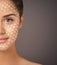 Using technology for the benefit of your skin. Enhanced portrait of a beautiful model with perfect skin posing in studio