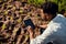 Using technology to check the soil. a handsome young male farmer using a tablet while working on his farm.