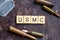 USMC sign with weapon bullets and army dog tags on rusty metal background. Military industry, United States Marine Corps concept