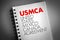 USMCA - United States Mexico Canada Agreement acronym on notepad, concept background