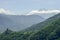 Ussel castle and village with clouds around peak Torche, Italy