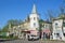 Ussuriysk, Russia, May, 19, 2016. Car near the monument of architecture of the late 19th century - Department store of the tradin