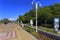 Ustka, Pomerania, Poland - Pedestrian promenade at the Baltic Sea shoreline along the beach and the Slupia river