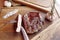 Ñut steak on a wooden board, medium well knife, fork