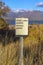 Utah Lake Public Access Point sign on a grassy terrain viewed on a sunny day