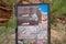 Utah, USA - May 14, 2021: Sign for the Hickman Bridge trailhead in Captiol Reef National Park on a cloudy spring day