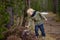 Ð¡ute little boy examines a Heather Bush in the Swiss National Park in the spring