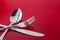 Utensils Fork Spoon Knife on Red Table