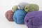 Uterus for knitting with hands of wool. Several pieces gray green blue purple red