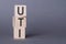 UTI - abbrevation from letter wood cubes on gray background