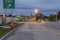 UTICA, NEW YORK - SEP 30, 2018: Night shot of Utica City Streets with sign and traffic light in the background