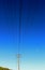 Utility pole and electricity wires and cables, blue sky, moon