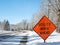 UTILITY WORK AHEAD sign warns traffic about a work zone on winter street