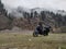 Uttarakhand, India - April 7th, 2021 : Motorbiker travelling, autumn day, motorcycle off road, the driver stands with open arms to