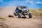 UTV in action offroad vehicle racing on sand dune. Extreme, adrenalin. 4x4