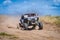 UTV in action offroad vehicle racing on sand dune. Extreme, adrenalin. 4x4