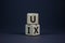 UX design or UI design. Turned cube and changed words UX user experience to UI user interface. Beautiful grey background. Business