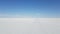 The Uyuni Salar in Bolivia. Close up video of the bright white hexagon salt flats.