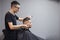 Uzbek hairdresser cuts a young guy in a barbershop, a male client sits in a beauty salon and makes a short fashion haircut, copy
