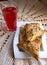 Uzbek national dish samsa and berry juice on a table covered with a handmade knitted napkin