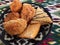 Uzbek national sweets on a plate with traditional ornament