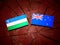 Uzbekistan flag with New Zealand flag on a tree stump isolated