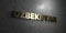 Uzbekistan - Gold text on black background - 3D rendered royalty free stock picture
